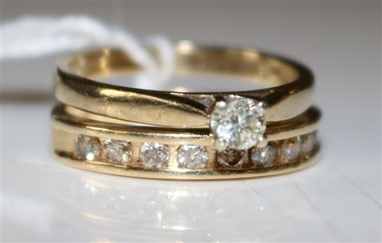 14K yellow gold and diamond half eternity ring and a 9ct gold diamond solitaire ring